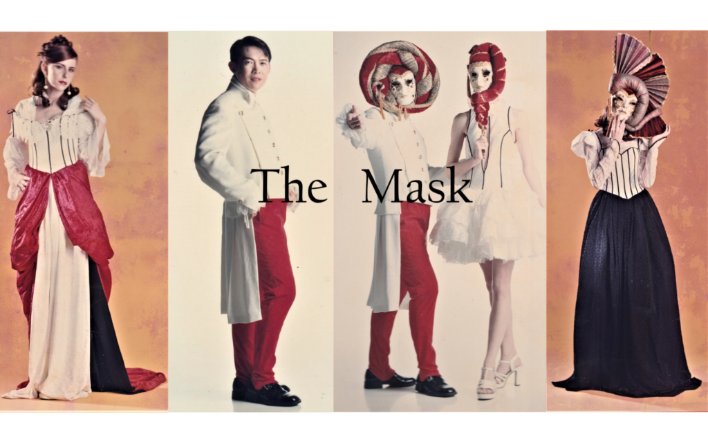 Fashion models in elaborate costumes and masks, showcasing a theatrical theme from 'The Mask' collection.